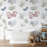 "Wall Blush's Great Barrier Wallpaper featuring coral and sea plant designs in a stylish bathroom setting."