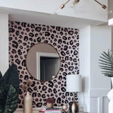 Cheetah Blush Wallpaper by Wall Blush accent in elegant living room with modern decor.
