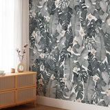 "Sophia Grace Wallpaper by Wall Blush in a stylish living room, showcasing tropical floral patterns."