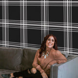 Davenport Wallpaper from The Chelsea DeBoer Line in a modern living room with plaid design focus.
