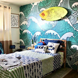 Wall Blush's Maui Wallpaper featuring oceanic patterns in a vibrant themed bedroom
