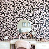 Cheetah Blush Wallpaper by Wall Blush in stylish bedroom, featuring vanity and chic decor.
