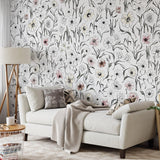 Scribe Wallpaper by Wall Blush SG02 in a modern living room, emphasizing elegant floral patterns.
