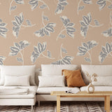 Wall Blush Leah Wallpaper in a cozy living room, showcasing leafy designs and neutral tones.
