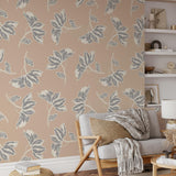 "Leah Wallpaper by Wall Blush in a cozy living room, highlighting elegant leaf patterns as the focal point."