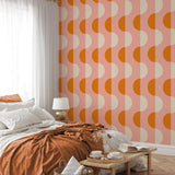 "Modern bedroom featuring Donna Wallpaper by Wall Blush with stylish geometric orange pattern."