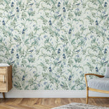 Wall Blush SG02's Fly Away with Me Wallpaper in a cozy living room, featuring vibrant floral patterns.
