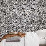 Nala Wallpaper by The Chelsea DeBoer Line featured in a stylish, cozy bedroom setting, highlighting the unique pattern.
