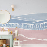 "Laguna Wallpaper by Wall Blush in a stylish children's room with whimsical ocean waves design, focused on wall decor."