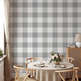 "Wall Blush Oswald - Buffalo Check Wallpaper in cozy dining room setup highlighting stylish wall decor."