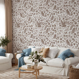 "Cottonwood Wallpaper by Wall Blush in a cozy living room, with a focus on the elegant botanic pattern."