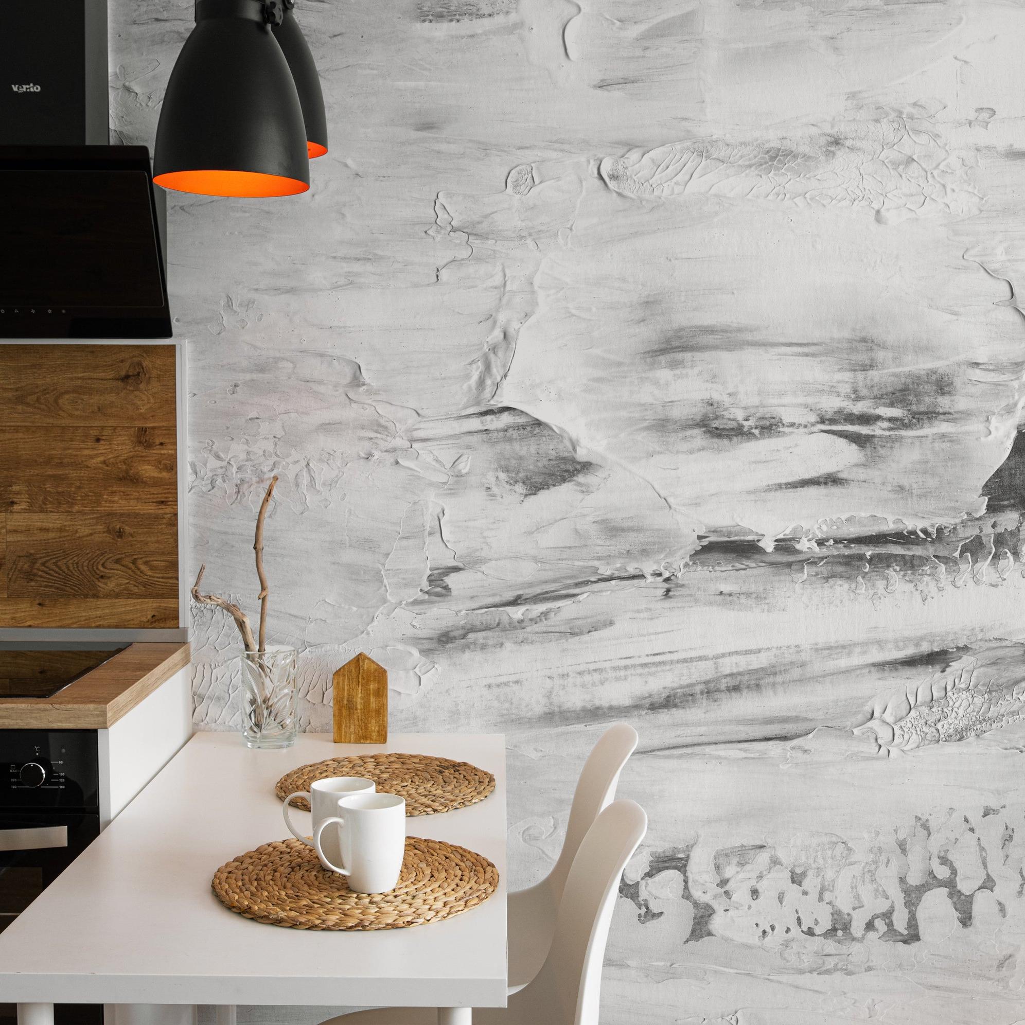 Modern kitchen featuring The A&S Line's Paint It Black Wallpaper, artistic monochrome focus.
