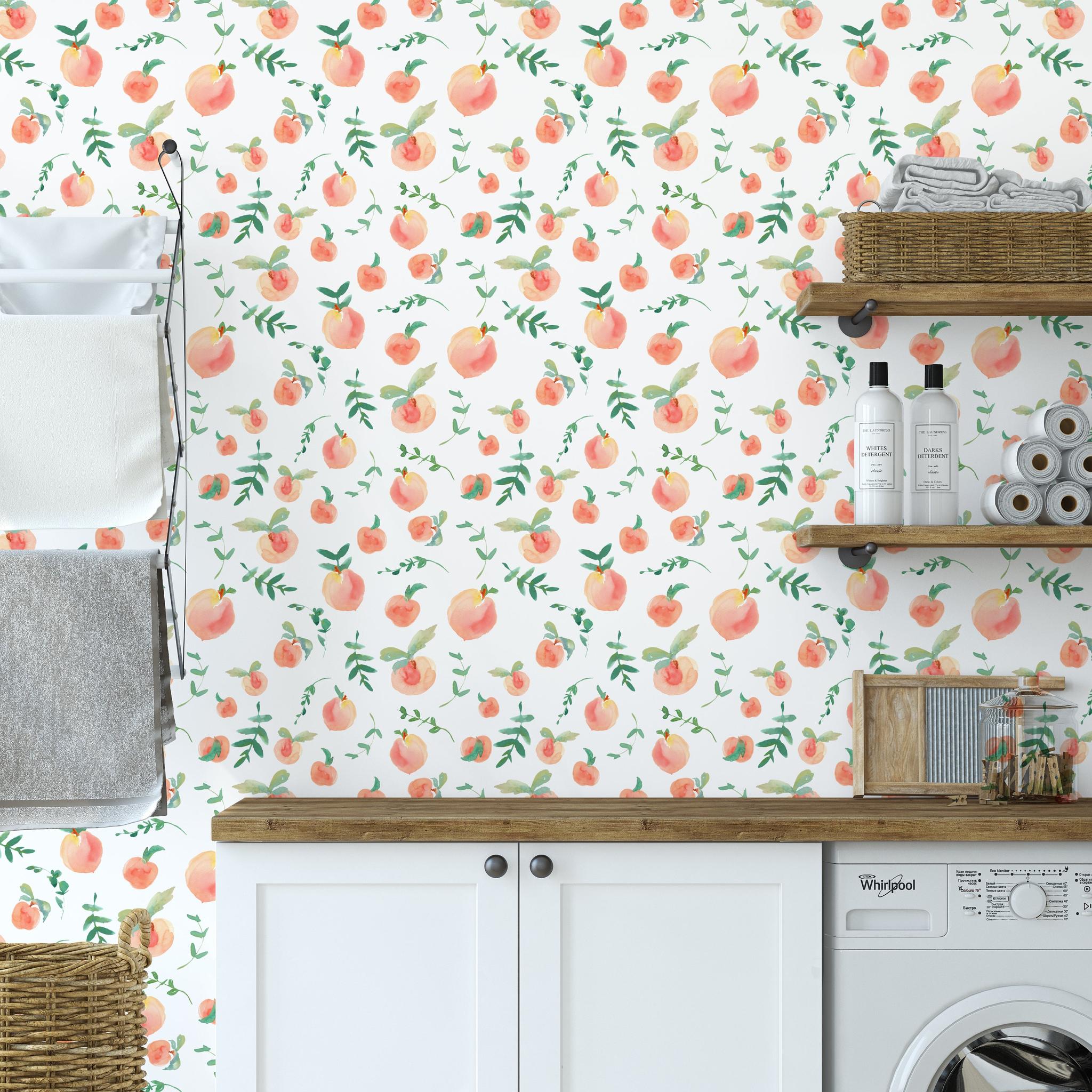 "Peachy Clean Wallpaper by Wall Blush featured in stylish laundry room, highlighting playful peach pattern design."