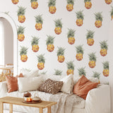 "Tropic Like It's Hot Wallpaper by Wall Blush in cozy living room, pineapple pattern focus on wall design."