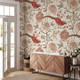 "Wall Blush's Scarlet Wallpaper featuring elegant floral and bird design in a stylish living room setting."