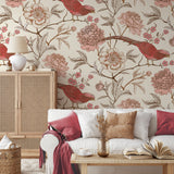 "Wall Blush Scarlet Wallpaper in a cozy living room with floral and bird patterns, accenting a stylish interior."
