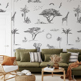 "Pride Lands Wallpaper by Wall Blush in a stylish living room, with focus on the elegant, safari-inspired wall decor."