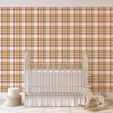 Ruth Wallpaper from The Stefanie Bloom Line, enhancing a nursery's decor with a warm, plaid pattern focus.
