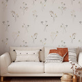 "Prairie Wallpaper by Wall Blush in a stylish living room with a neutral-toned couch and decorative pillows."