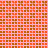 "Wall Blush Jackie Wallpaper with orange floral pattern in modern living room setting, showcasing stylish home decor."