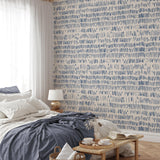 "Tally Wallpaper by Wall Blush in a stylish bedroom with blue accents, highlighting modern home decor trends."
