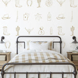 Outlaw (Tan) Wallpaper by Wall Blush SG02 featured in a stylish, cozy bedroom with a focus on the wall decor.

