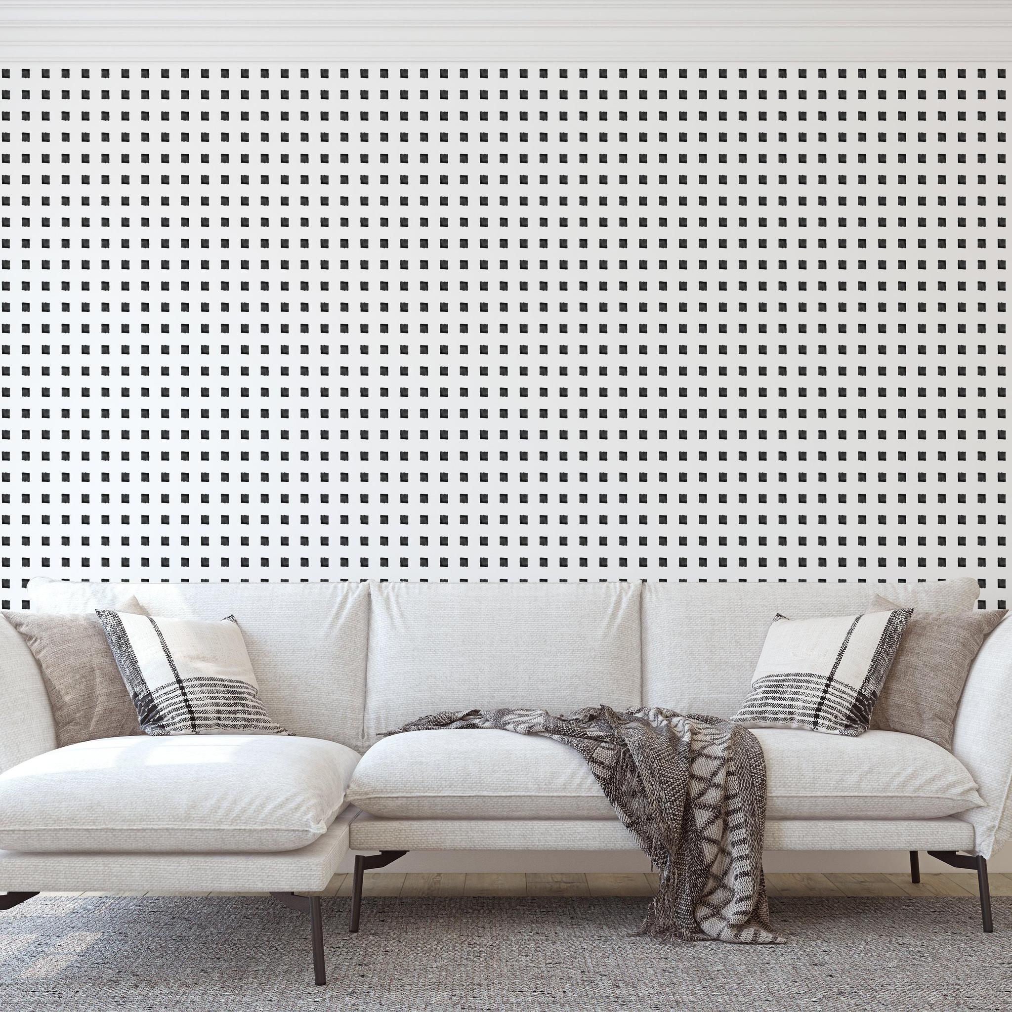 Modern living room featuring The Tara Wallpaper by Wall Blush, showcasing elegant black and white patterns.
