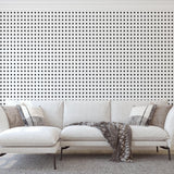 Modern living room featuring The Tara Wallpaper by Wall Blush, showcasing elegant black and white patterns.
