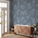 "Wall Blush's Tiffanys Wallpaper in an elegant living room setting with focus on the floral design."