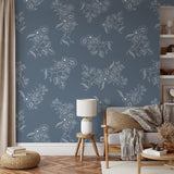 "Tiffany's Wallpaper by Wall Blush with floral patterns in a cozy modern living room setting, focus on elegant design."