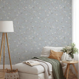 "Wall Blush Versailles Wallpaper in cozy bedroom setting with elegant floral design"