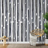 "Stripped by Spencer Wallpaper from Wall Blush in a stylish living room setting, highlighting modern design."