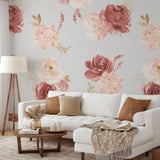 "Wall Blush Vogue Wallpaper featuring floral pattern in a cozy living room with white sofa and wooden furniture."