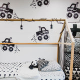 Gimme Some Speed Wallpaper by The Minty Line in a modern kids' room, featuring playful truck designs.

