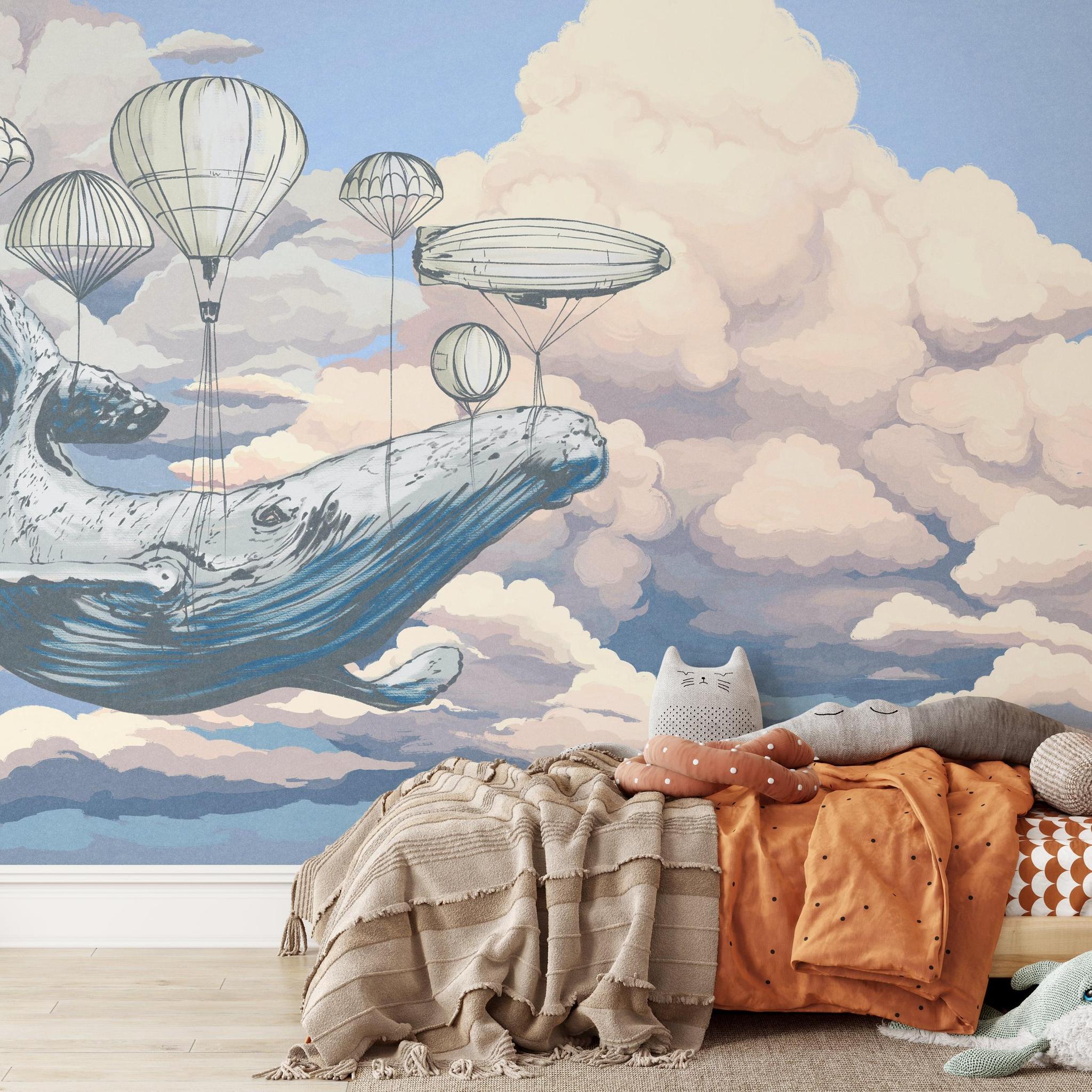 Moby's Dream Wallpaper by Wall Blush SG02 in a cozy kids' room, highlighting whimsical whale and hot air balloon design.
