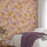 "Bridget Wallpaper by Wall Blush accenting bedroom walls with floral design, cozy bedding in focus."