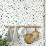 "Wall Blush Wildflower Wallpaper in a rustic kitchen accentuating the decor with its floral pattern."