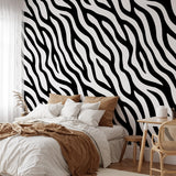 "Dazzle Wallpaper by Wall Blush featured in modern bedroom, striking black and white design focal point."